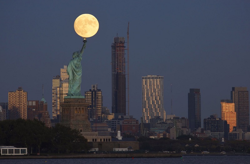In Photos: Hunter's Moon illuminates night sky around the world