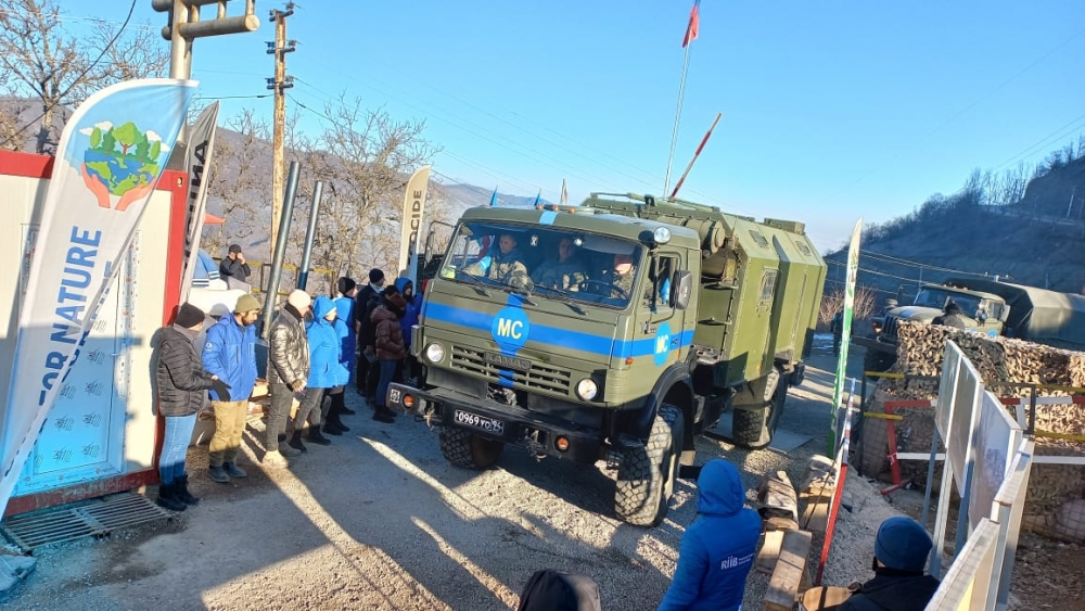 Two vehicles of Russian peacekeepers pass freely along Lachin-Khankandi road